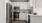 a kitchen with white cabinets