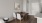 a room with a table chairs and a mirror