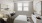 a bedroom with a bed and a mirror