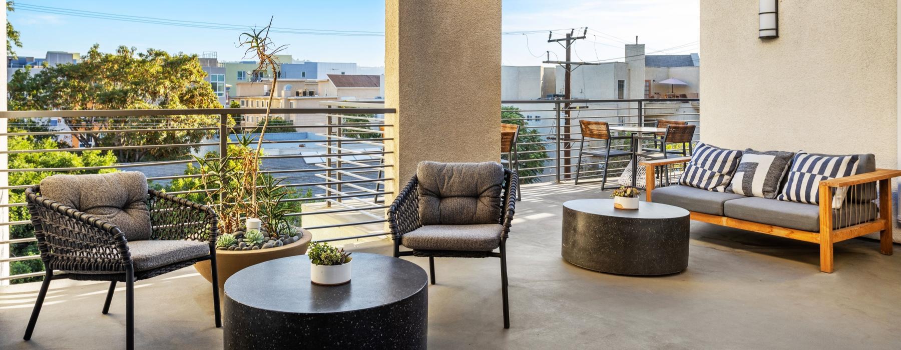 a patio with chairs and tables