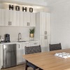 a kitchen with white cabinets